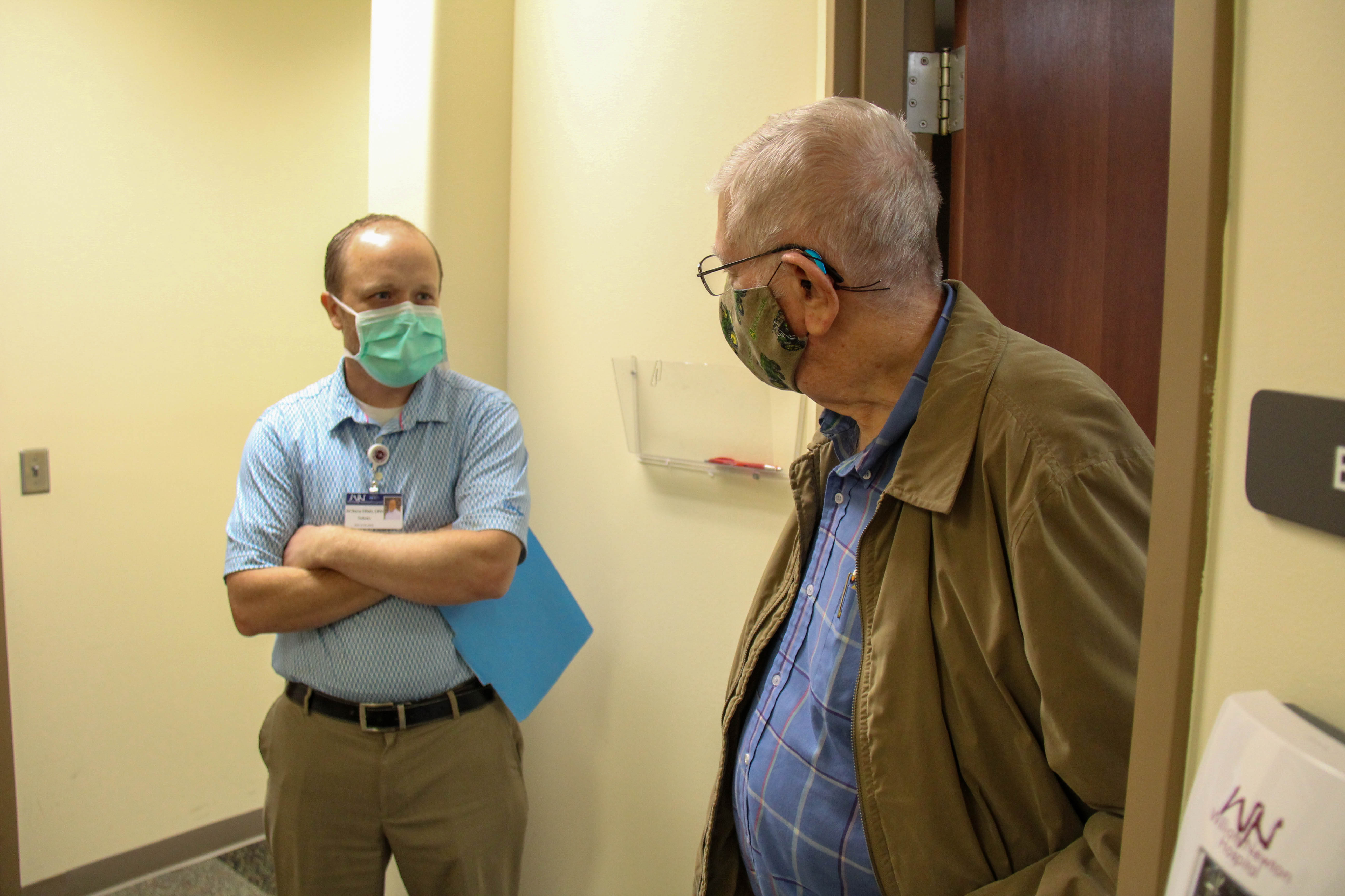 Dr. Elliot having discussion with patient