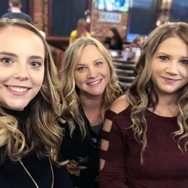 Traci (middle) with her daughters, Kirstie (left) and Courtney (right).